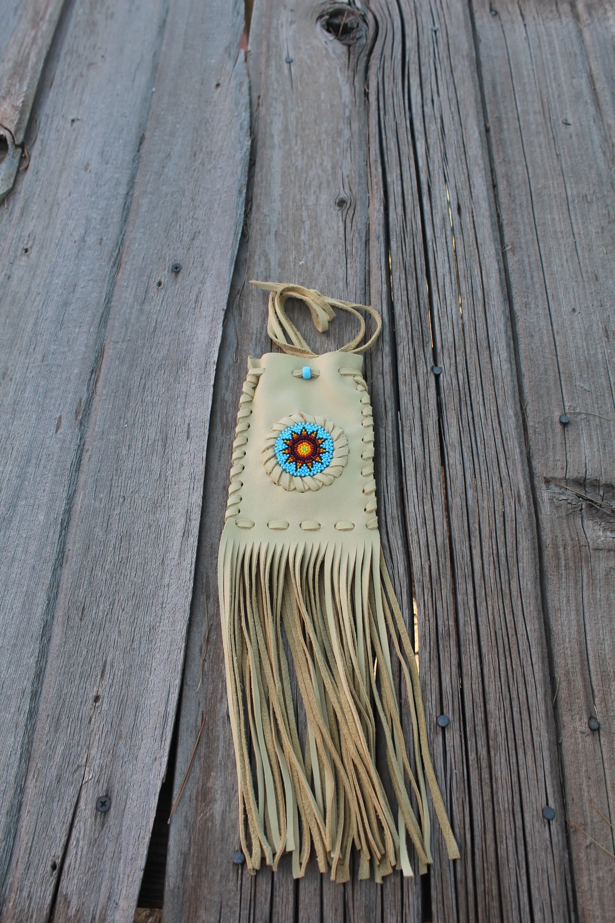 Beaded fringed medicine bag, beaded leather pouch