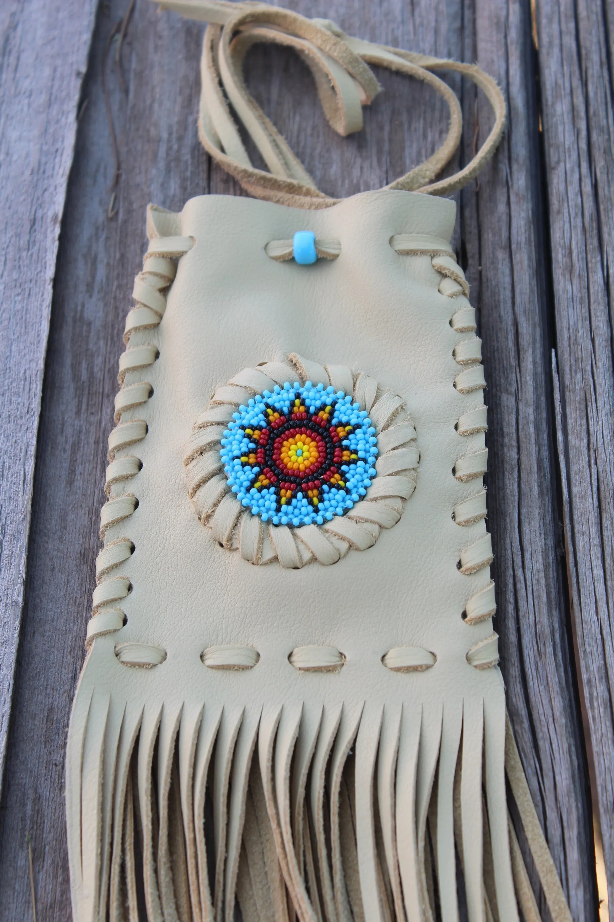 Beaded fringed medicine bag, beaded leather pouch